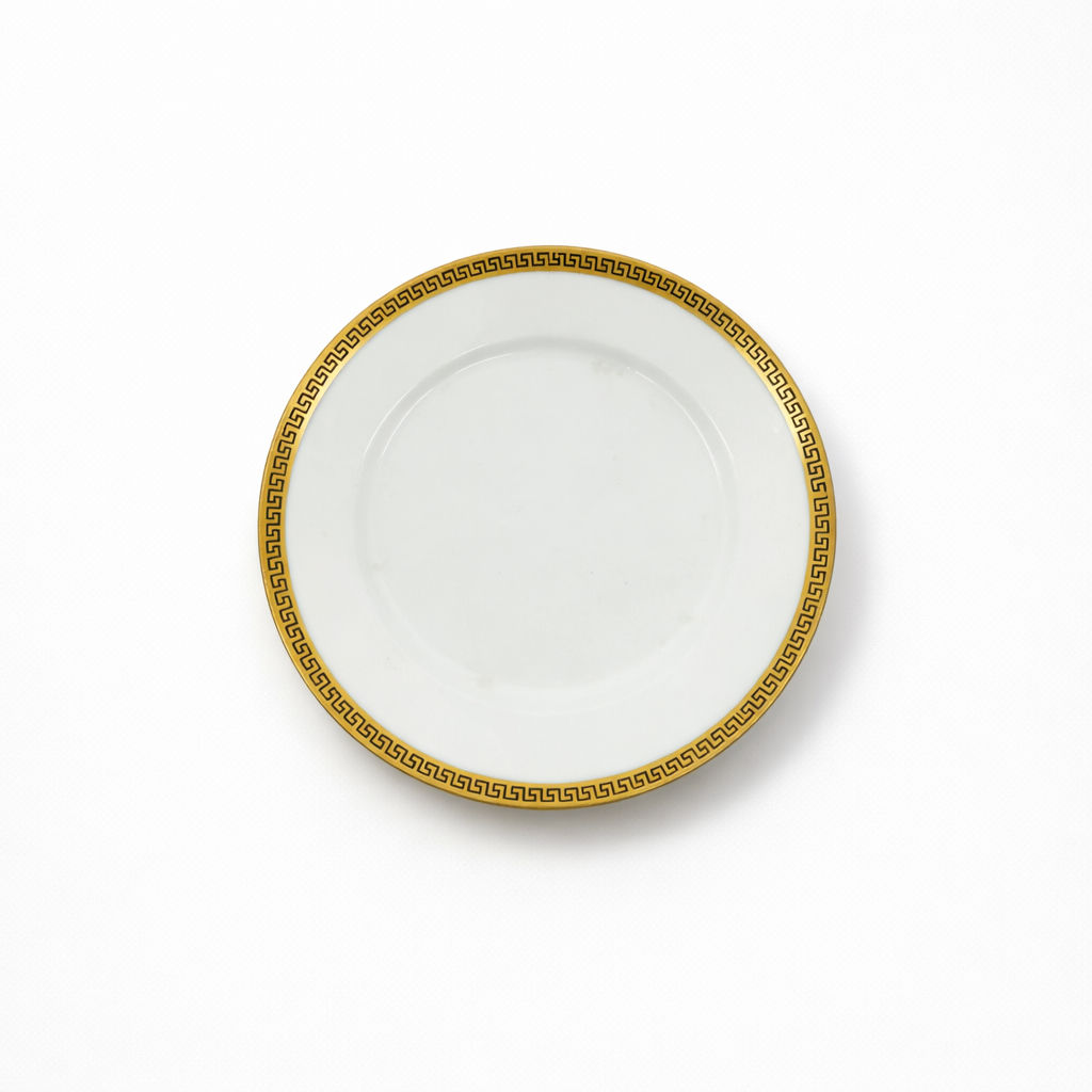 sous-tasse en porcelaine Limoges Bétoule-Legrand à décor doré de frise grecque 16 cm