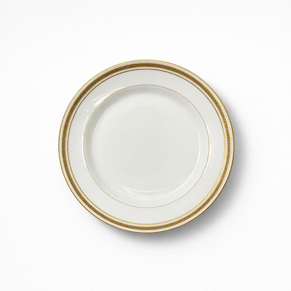 plat rond en porcelaine Limoges Touze Lemaître Frères & Blancher à décor doré de frise grecque et liseré doré 27 cm