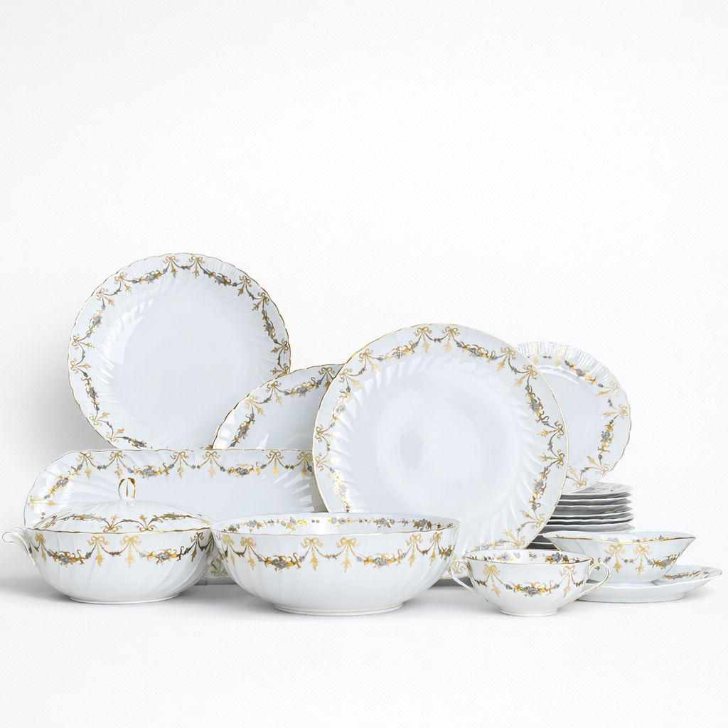 plat rond en porcelaine Bernardaud modèle Marie-Thérèse fond blanc décor doré et argenté noeuds et guirlandes D 30 cm