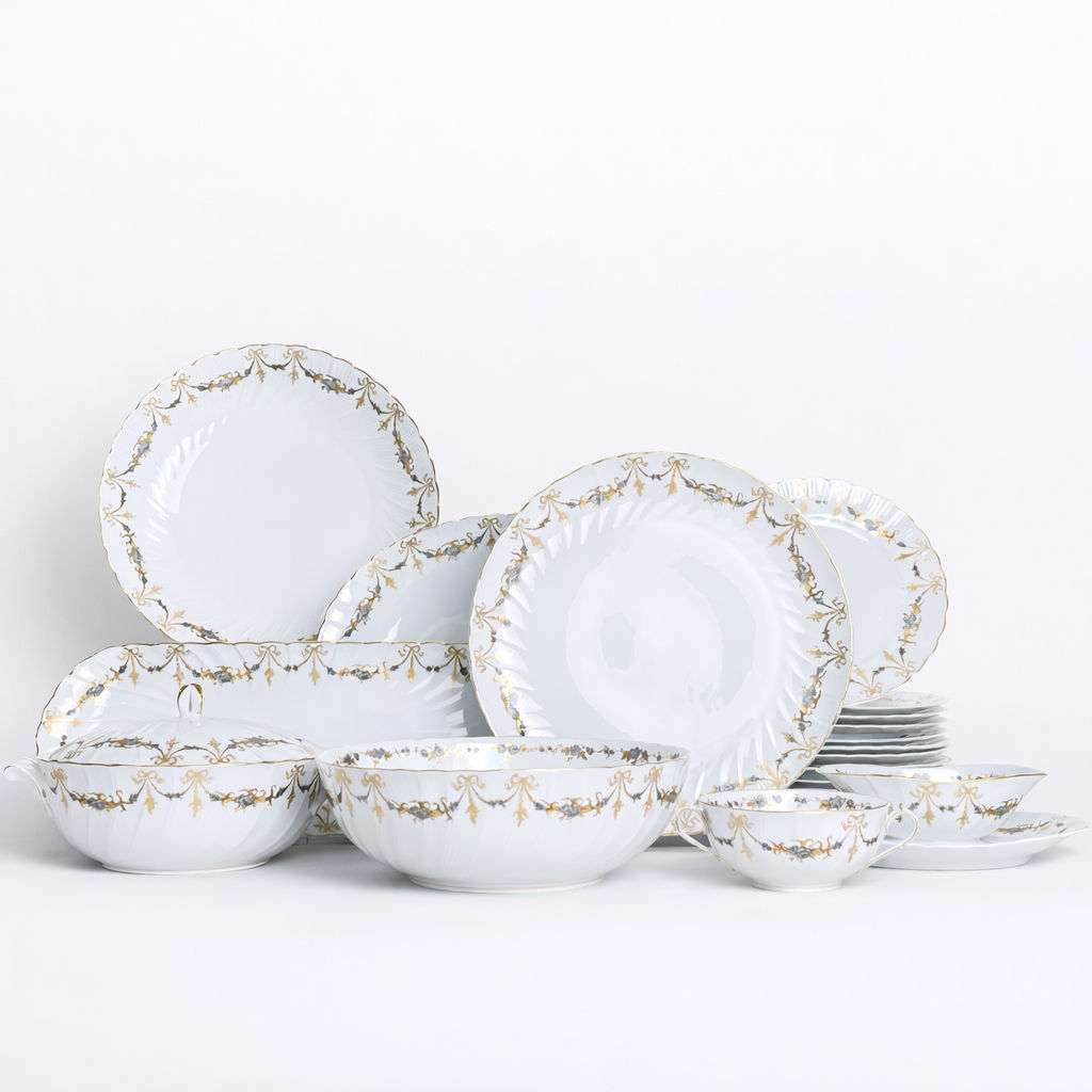 plat rond creux en porcelaine Bernardaud modèle Marie-Thérèse fond blanc décor doré et argenté noeuds et guirlandes H 5 x D 29 cm