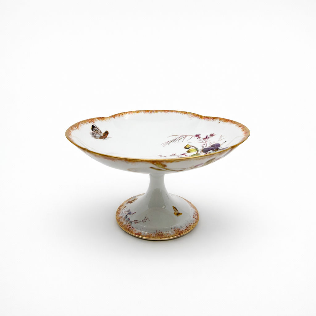 compotier en porcelaine Limoges William Guerin & Cie à décor de fleurs polychromes et papillon liseré doré